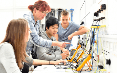 Trainees in training program with their tutor 