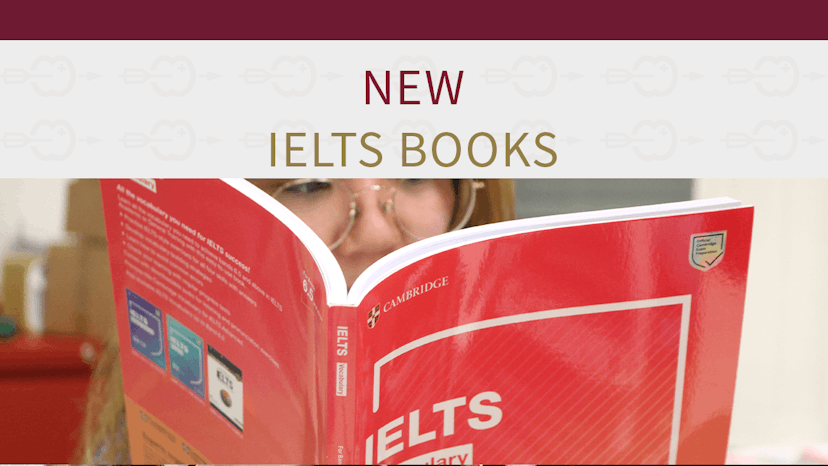 New IELTS book - young lady reading from IELTS textbook 