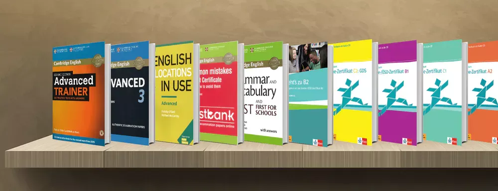 English, German and French exam preparation books in displayed on a shelf.