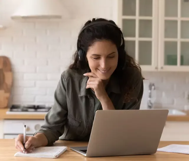 lady listening to Linguaskill Business webinar by Swiss Exams