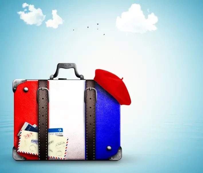 Suitcase prepared to travel to France - 8 Essential tips for a successful TCF exam day