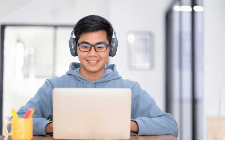 Student taking a remotely proctored exam online with Swiss Exams