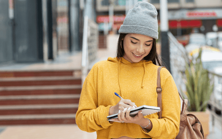 Student walking street thinking about taking Linguaskill modular test